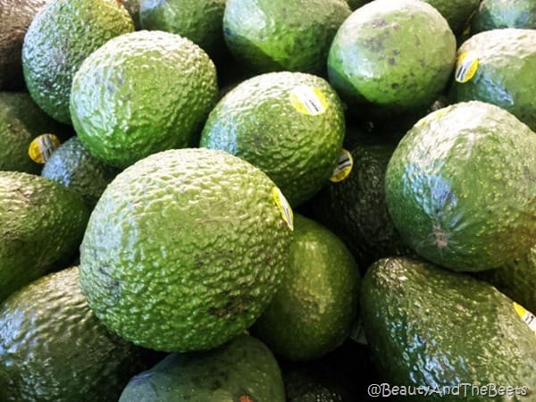 a pile of ripe green avocados for pea, avocado and radish stacks