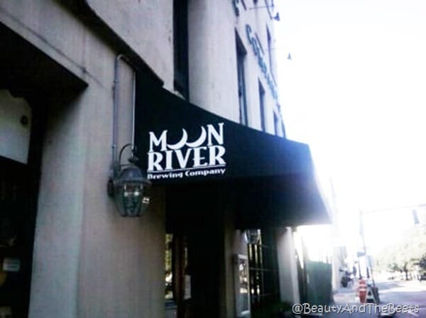 the awning of the Moon River Brewing Company on a street in Savannah