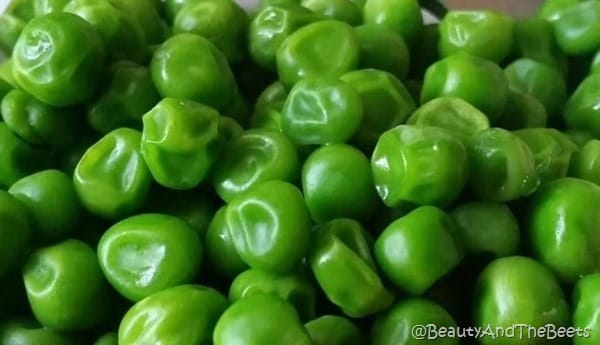 a close up of bright green sweet peas