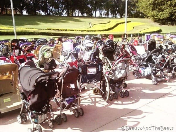 a mish mash of baby strollers on a sidewalk