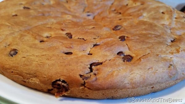 A round Vegan chocolate chip breakfast cake on a white plate