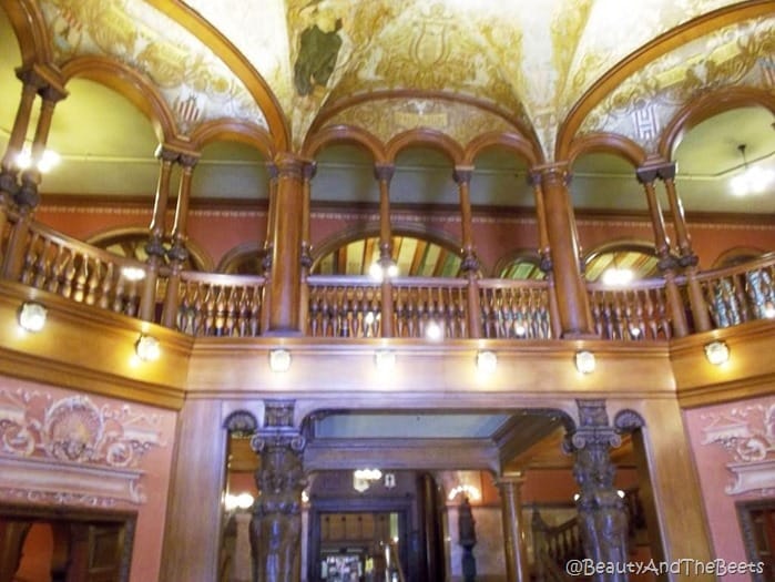 a fancy jewel like lobby to the hotel with the base of the gold dome 