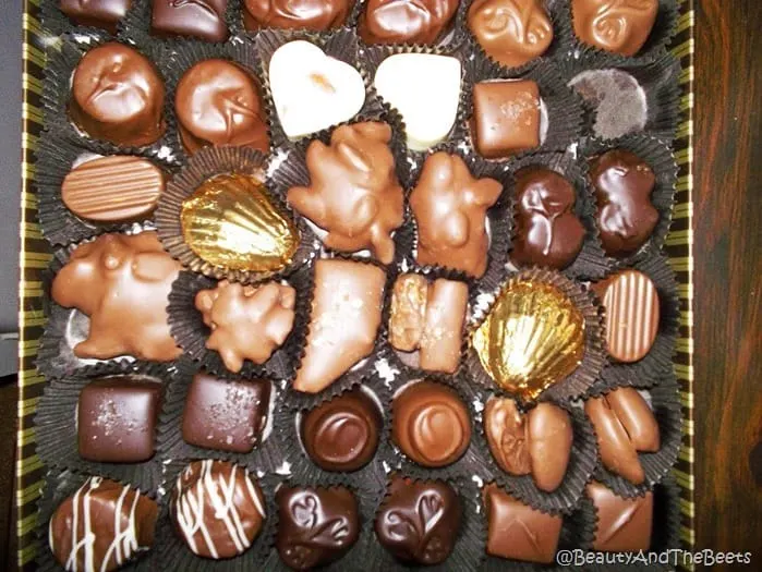 a box of various chocolates in a black background from Whetstone Chocolates