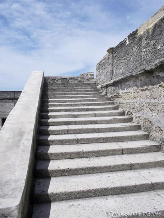 stone steps leading up to a bright blue sky